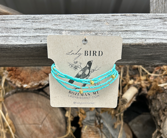 Turquoise and chunky gold or silver boho beaded wrap bracelet, showcasing vibrant Czech glass seed beads and metallic accents.