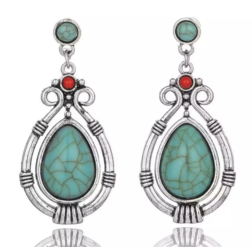 Turquoise dangle earrings featuring a water drop design, silver plated with a bullet back, elegantly gift packaged.