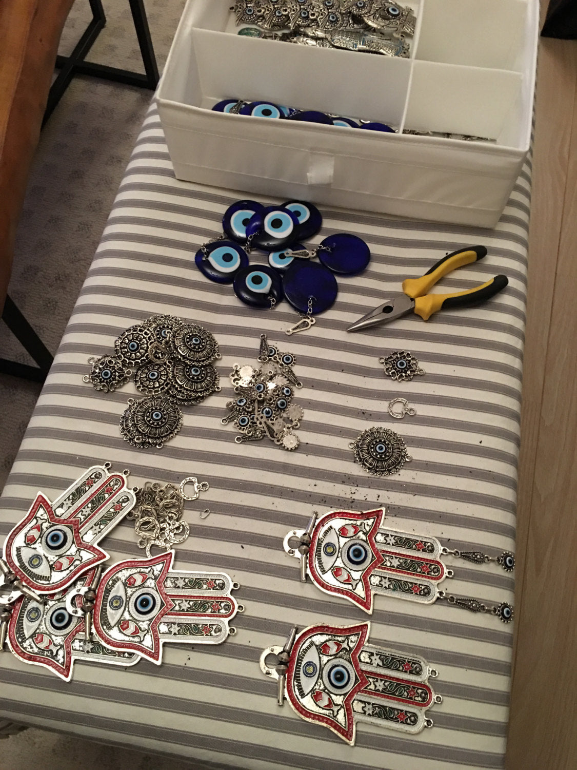 Turquoise Hamsa Evil Eye Wall Hanging featuring a mosaic metal hamsa hand and a large glass evil eye bead, symbolizing protection and good luck.