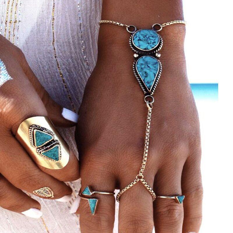 Turquoise hand bracelet featuring 18K gold plating, showcasing Italian craftsmanship and elegant design.