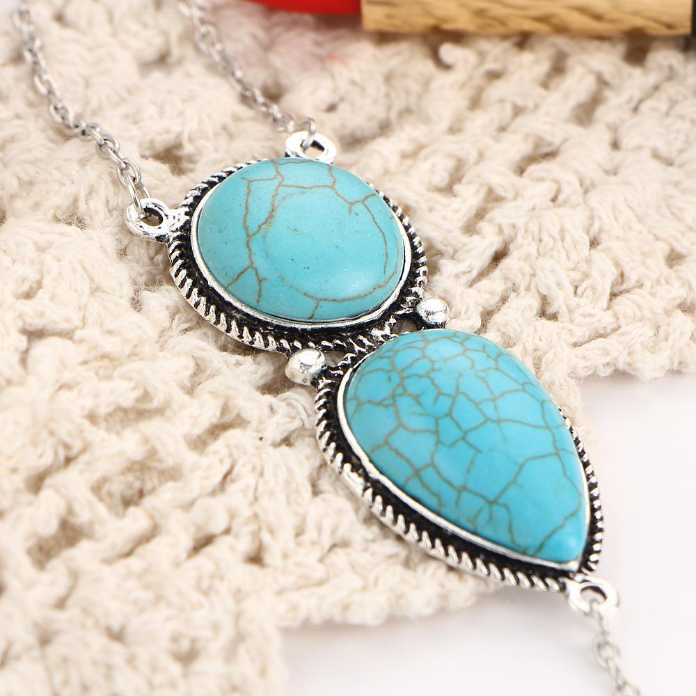 Turquoise hand bracelet featuring 18K gold plating, showcasing Italian craftsmanship and elegant design.