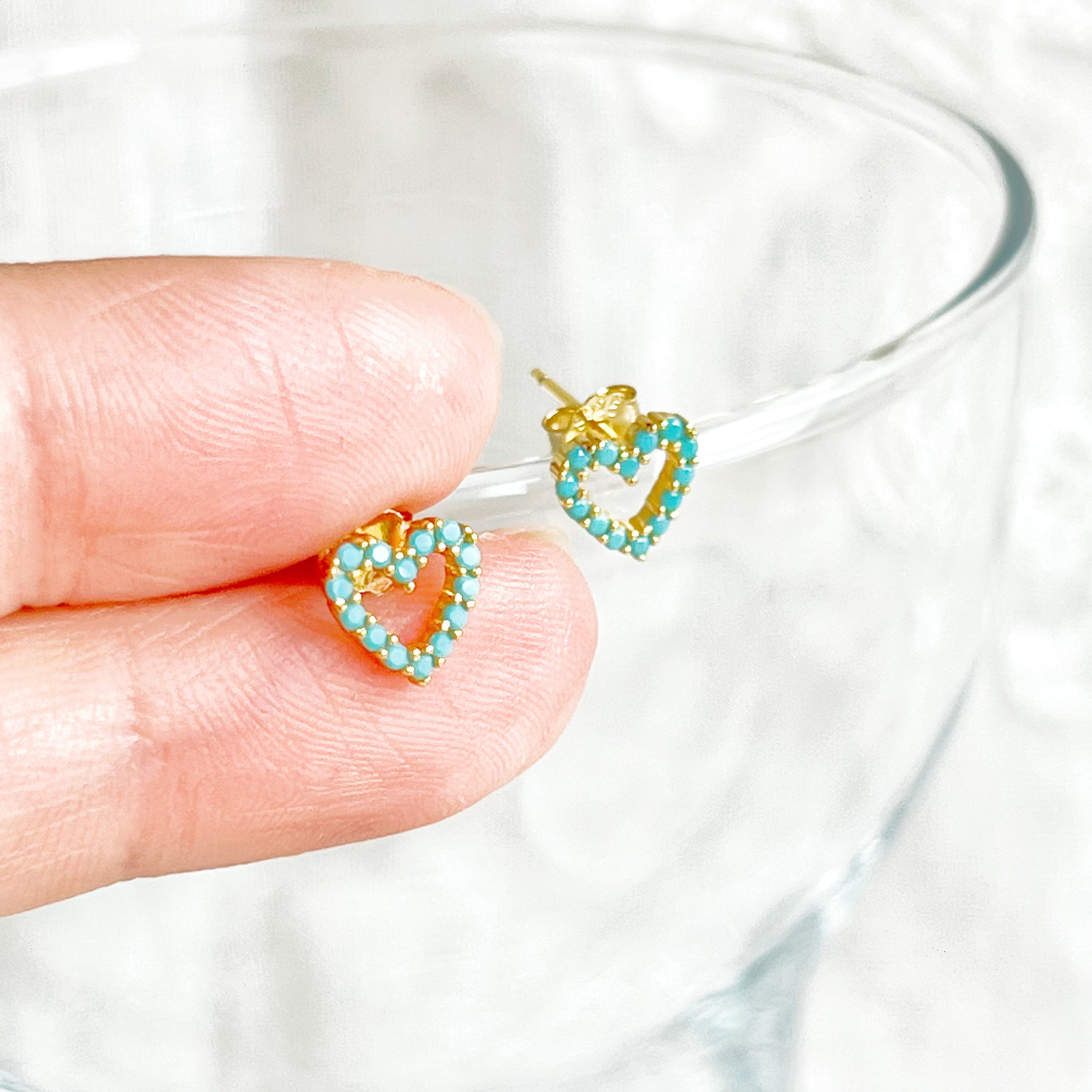 Turquoise Heart Sterling Silver Stud Earrings featuring mini turquoise stones and gold-plated sterling silver base, elegantly designed.