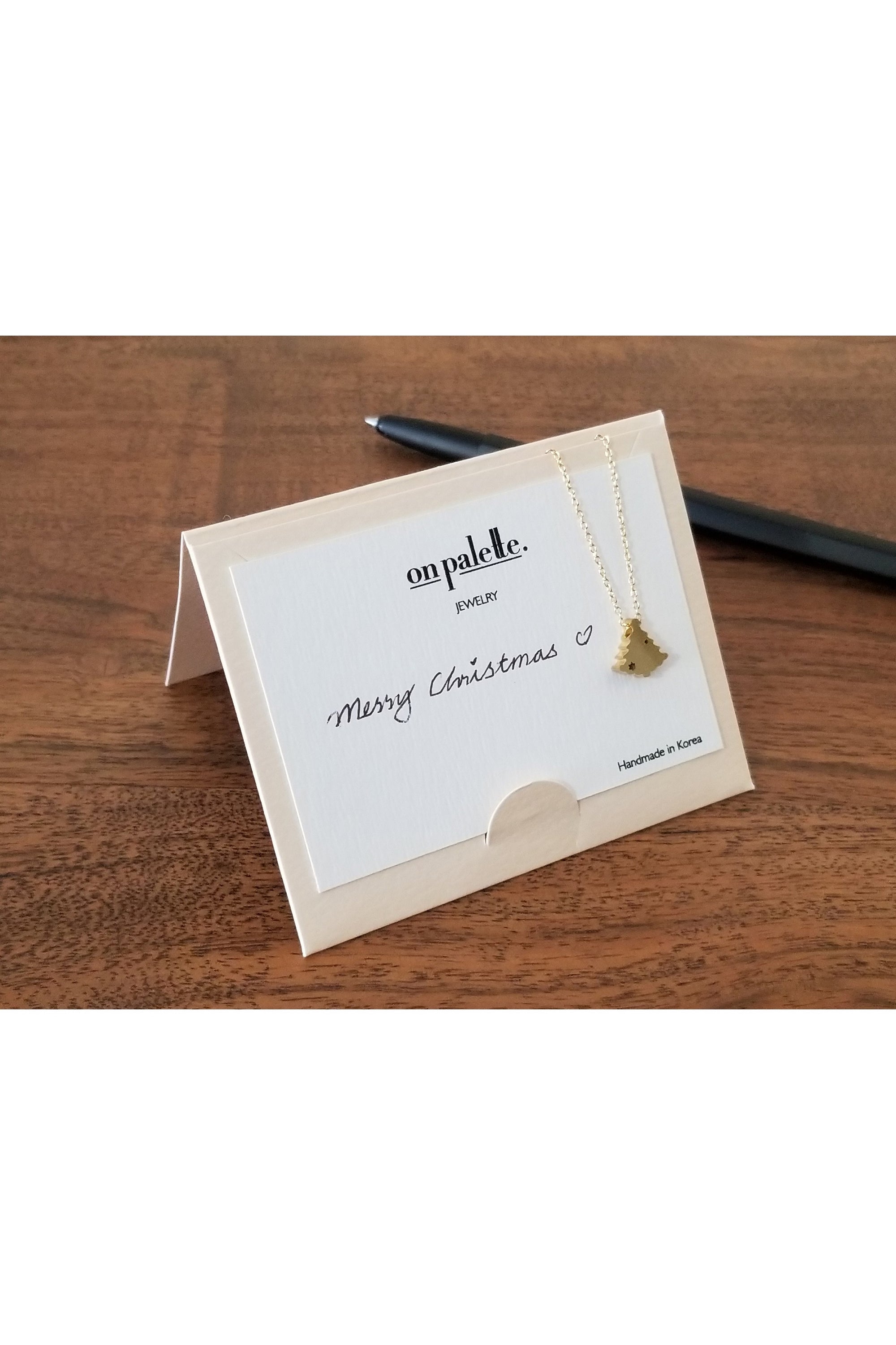 A stylish Turtle Pendant Necklace by DOBBI, featuring a turtle-shaped pendant made of stainless steel, available in various colors.