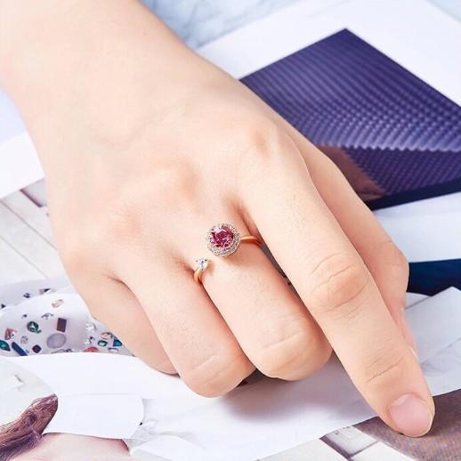 Twisted Pink Austrian Elements Circular Halo Adjustable Ring featuring 14K rose gold plating and pink stones, elegantly designed for comfort.