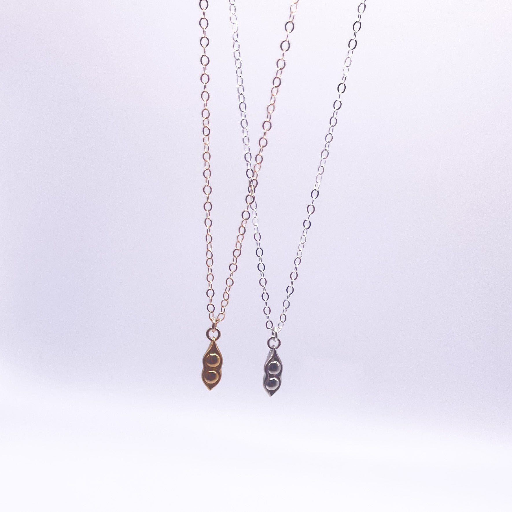 Two Peas in a Pod Necklace in gold fill and sterling silver, symbolizing friendship and connection.