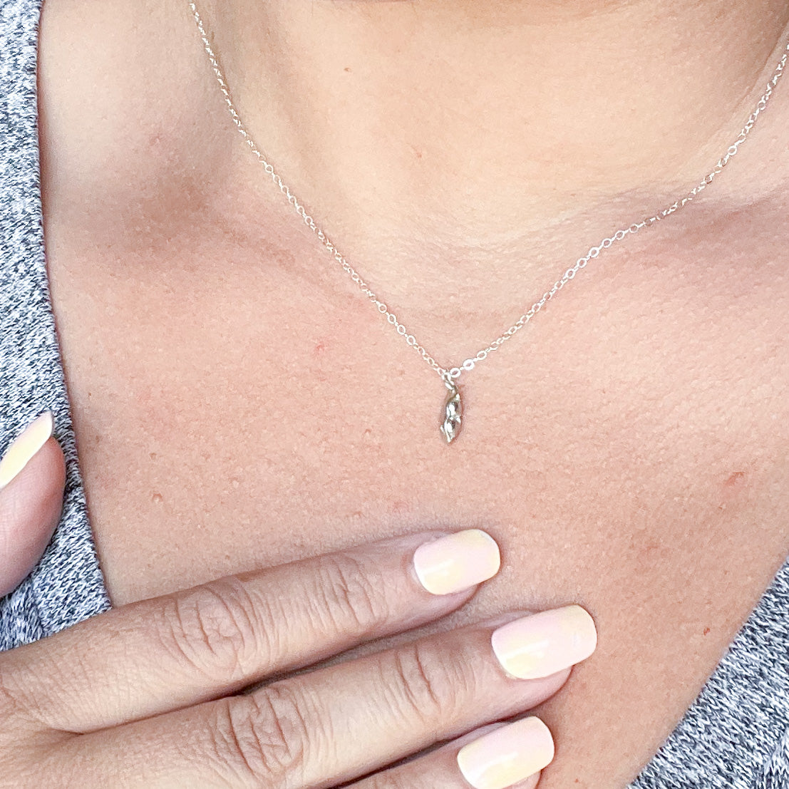 Two Peas in a Pod Necklace in gold fill and sterling silver, symbolizing friendship and connection.