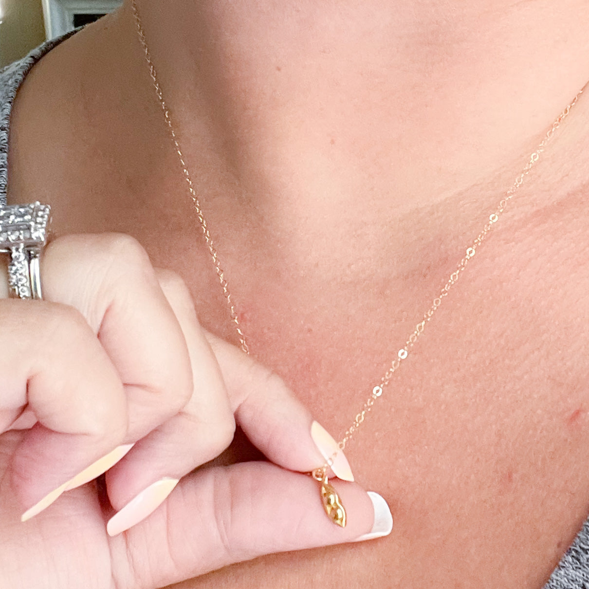 Two Peas in a Pod Necklace in gold fill and sterling silver, symbolizing friendship and connection.