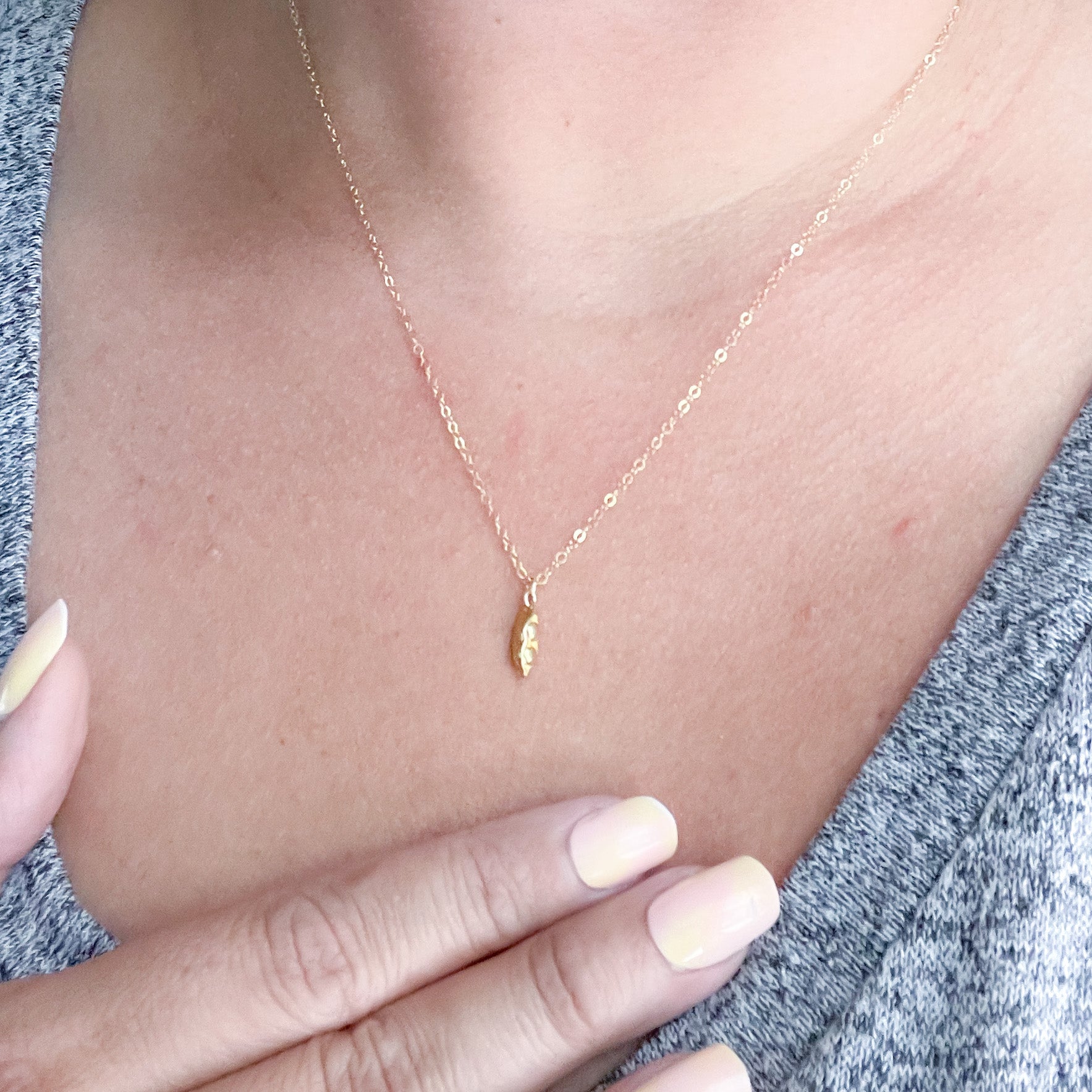 Two Peas in a Pod Necklace in gold fill and sterling silver, symbolizing friendship and connection.