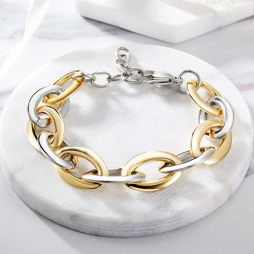 Two-Tone Oval Link Bracelet made of stainless steel with gold plating, showcasing its elegant design and durable construction.