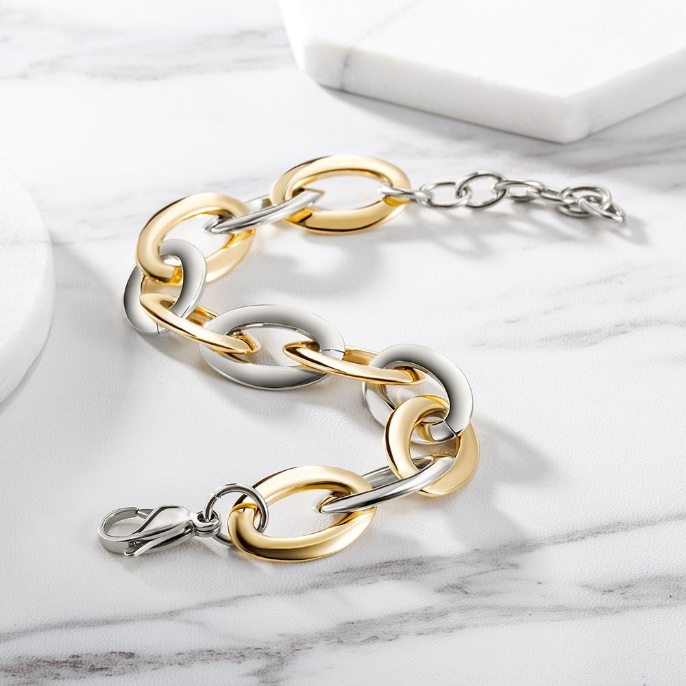 Two-Tone Oval Link Bracelet made of stainless steel with gold plating, showcasing its elegant design and durable construction.