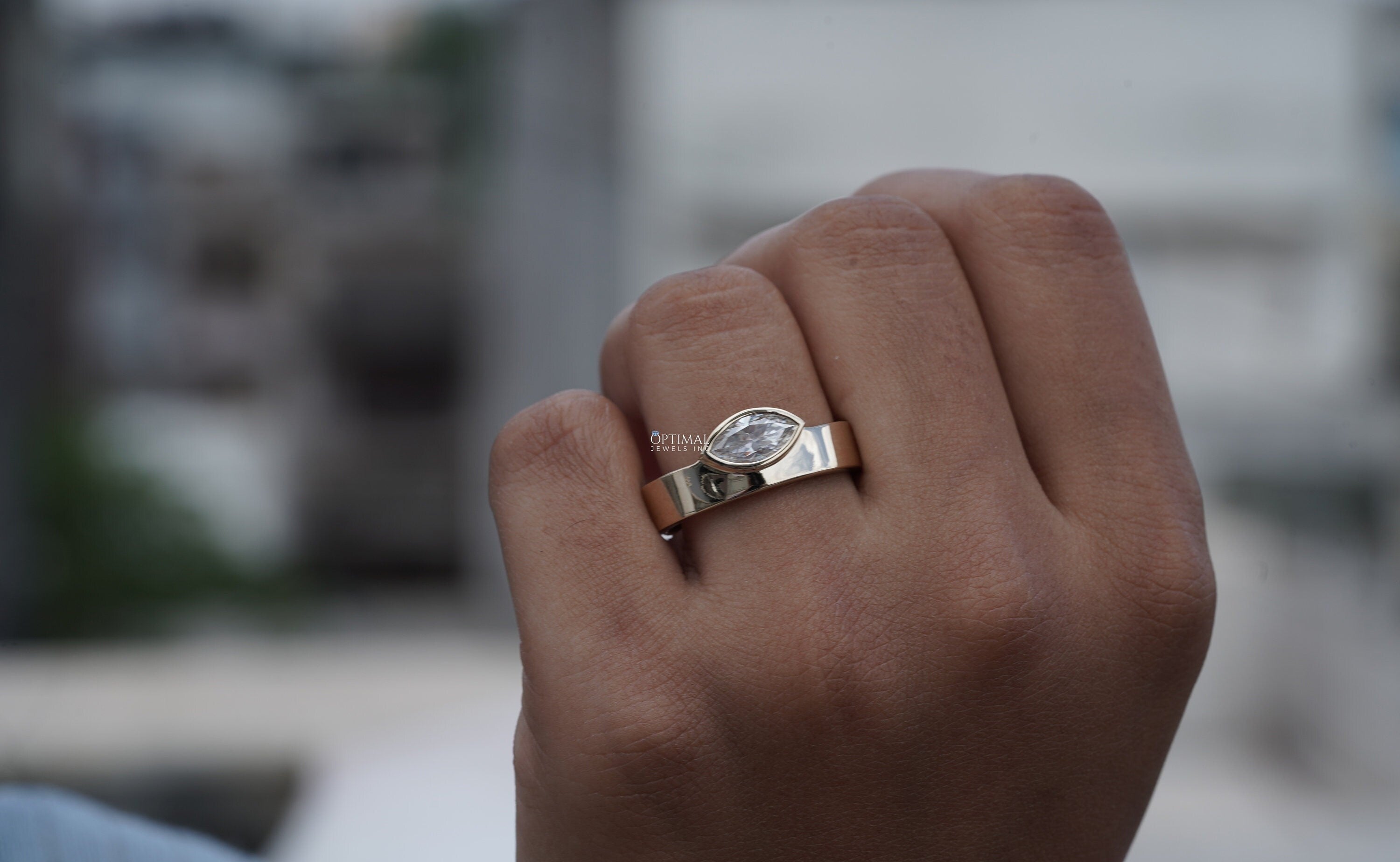 Unique 1.00 CTW Lab Grown Diamond Ring featuring a marquise cut diamond set in an 18K yellow gold bezel, perfect for engagements or anniversaries.