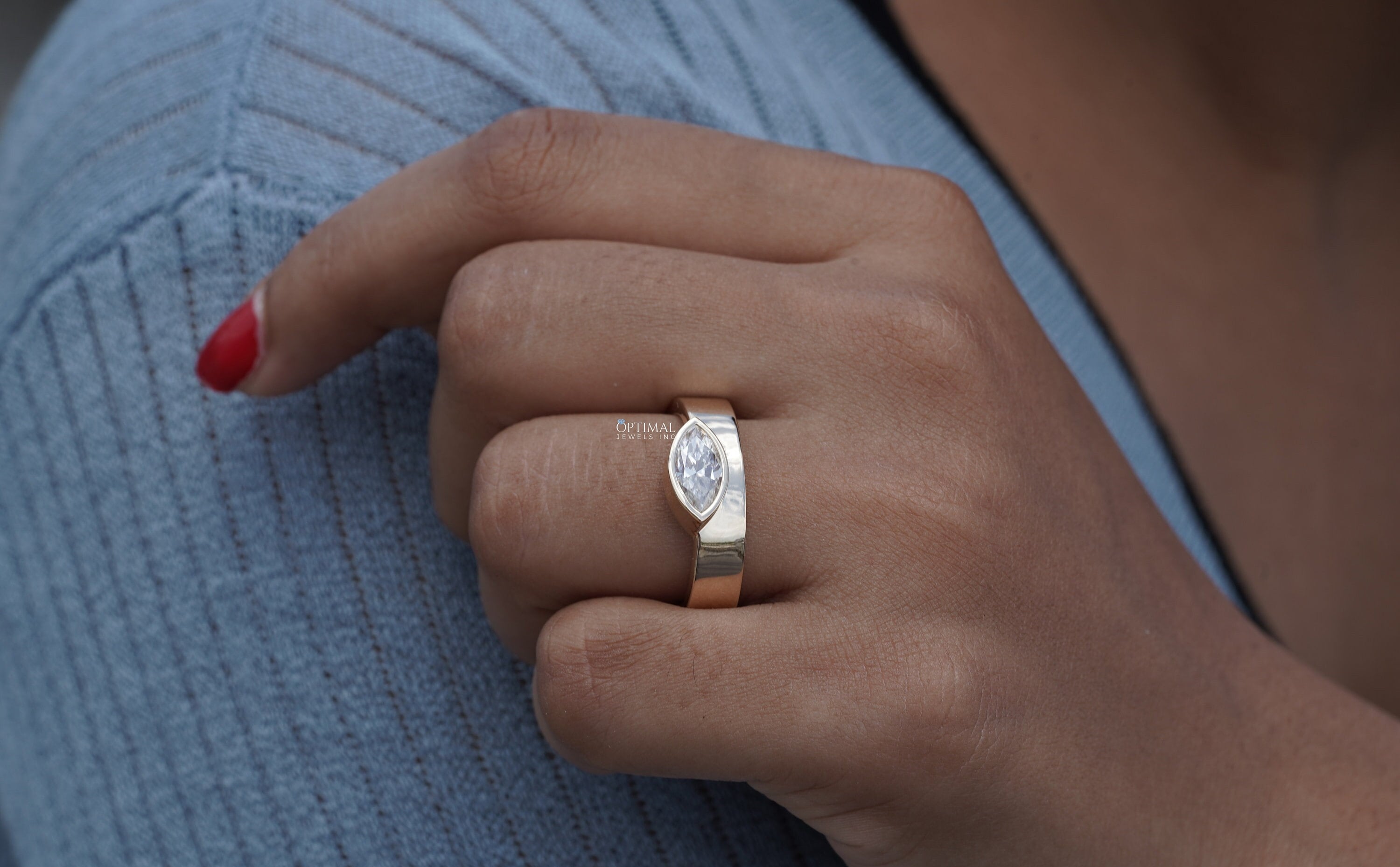 Unique 1.00 CTW Lab Grown Diamond Ring featuring a marquise cut diamond set in an 18K yellow gold bezel, perfect for engagements or anniversaries.