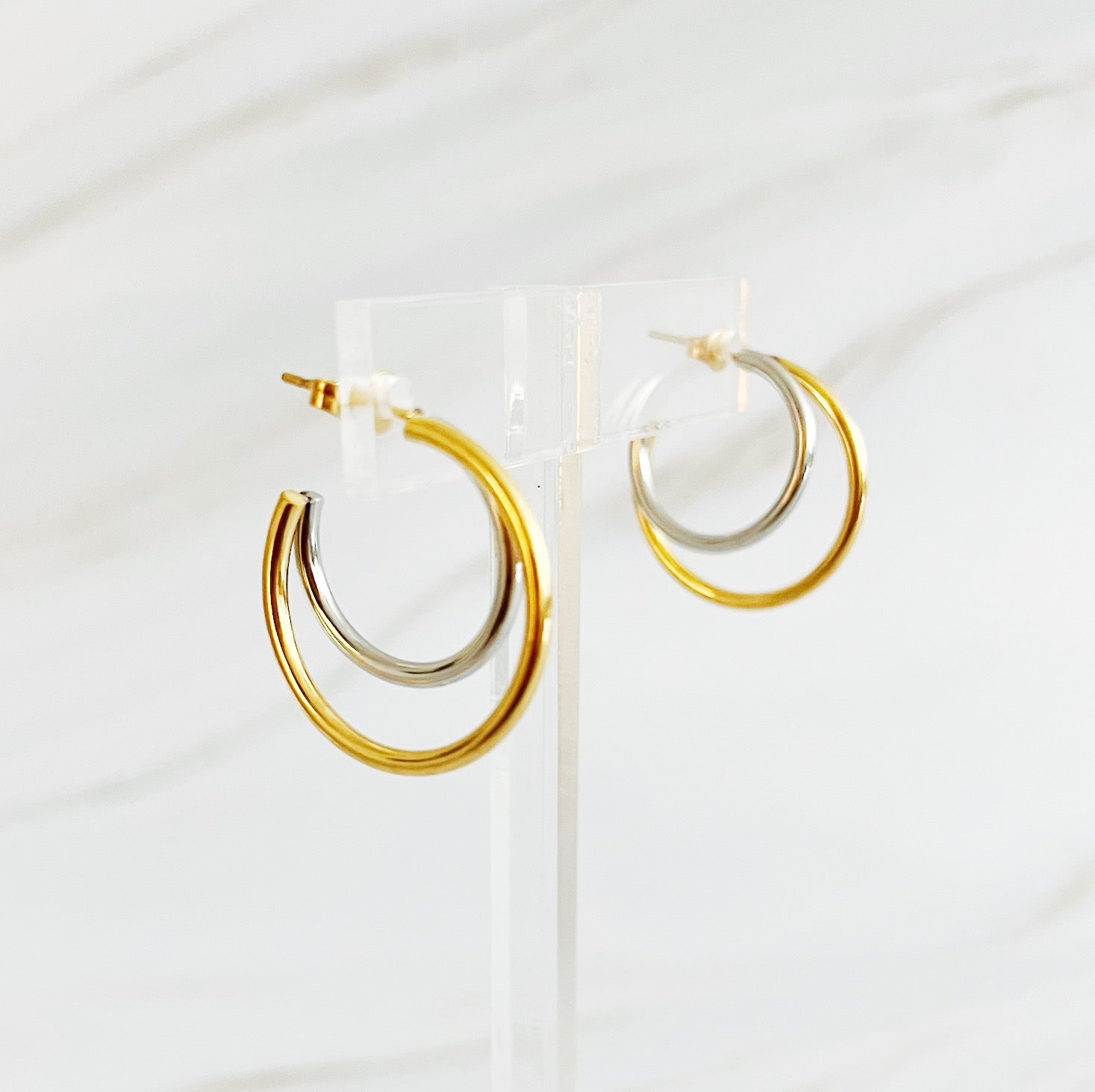 Elegant Uptown Two Tone Hoop Earrings featuring a modern design with 18k gold plating, perfect for any occasion.