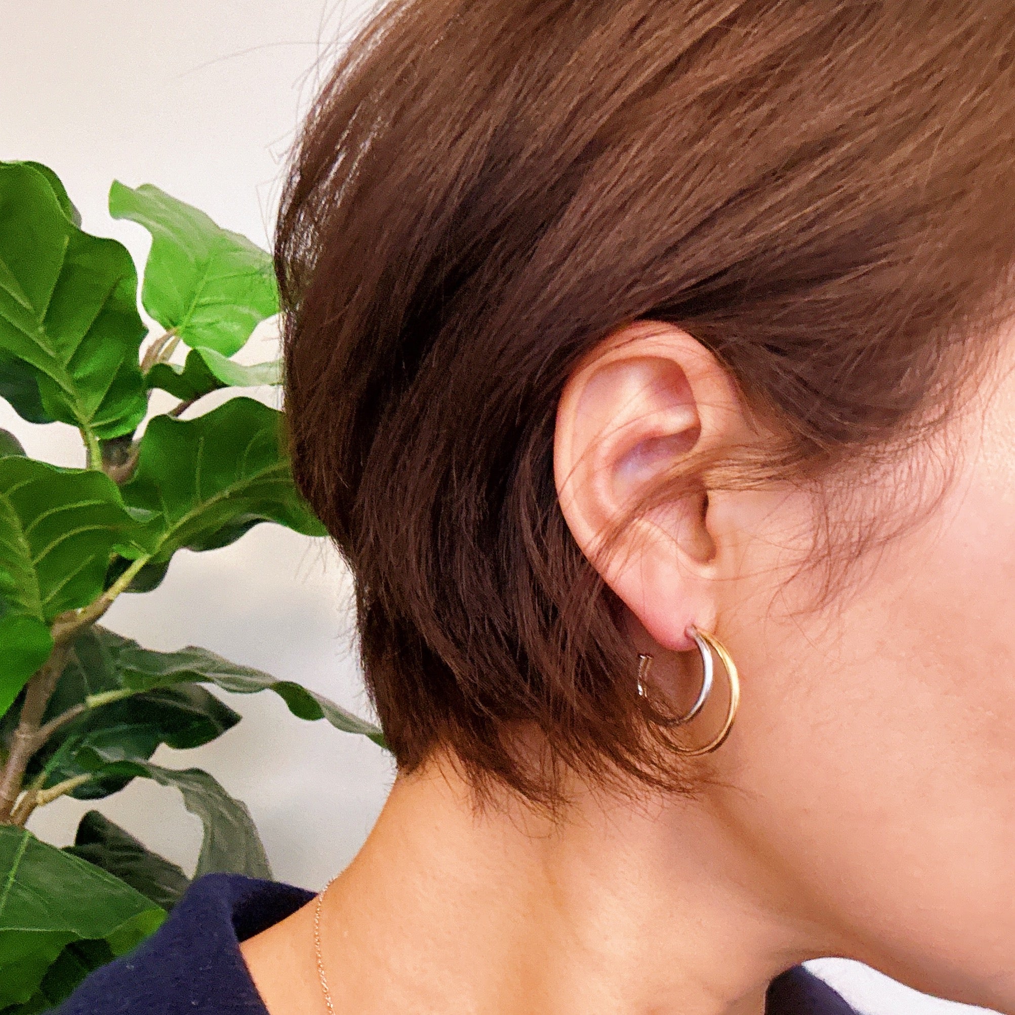 Elegant Uptown Two Tone Hoop Earrings featuring a modern design with 18k gold plating, perfect for any occasion.