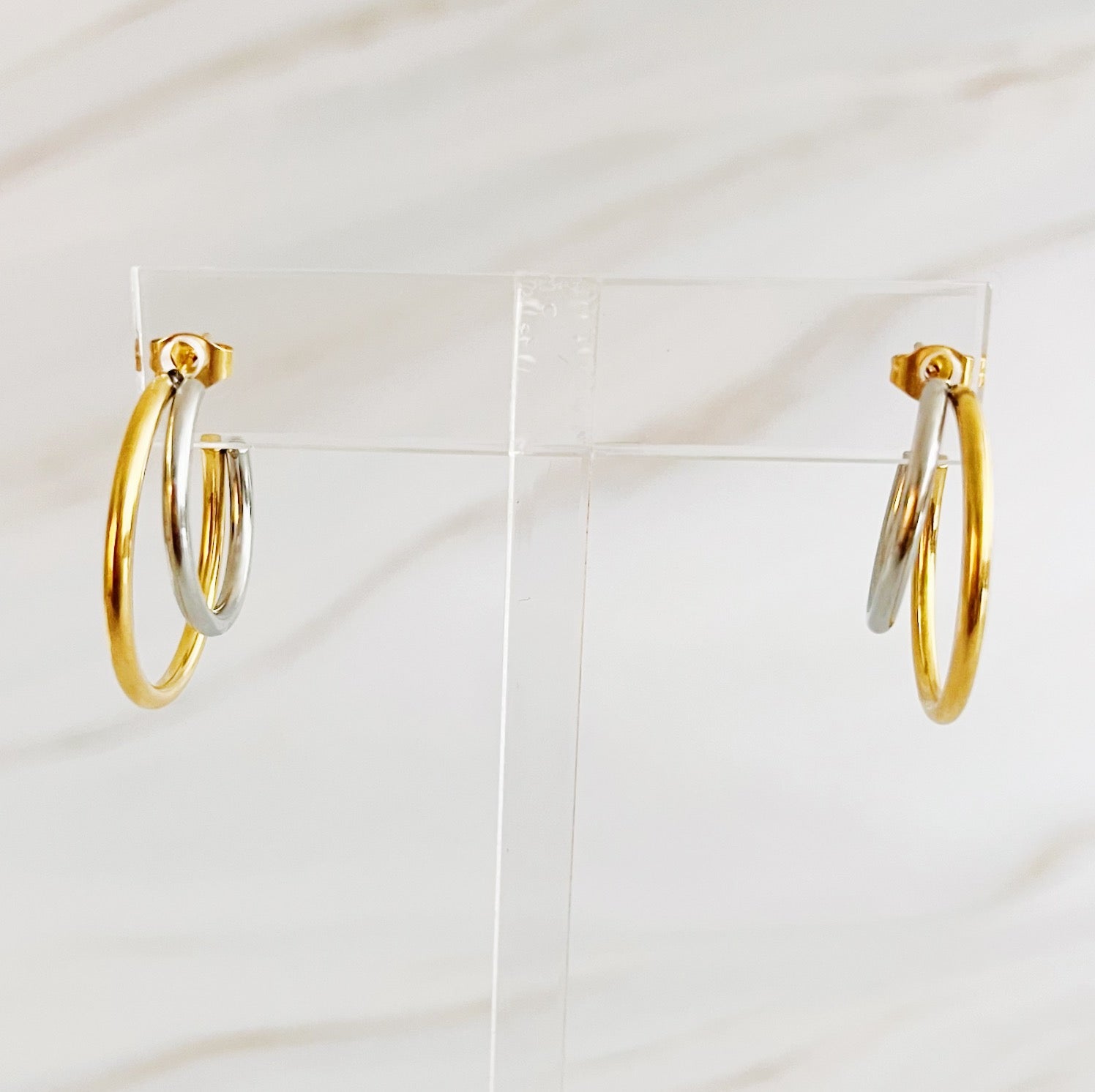Elegant Uptown Two Tone Hoop Earrings featuring a modern design with 18k gold plating, perfect for any occasion.