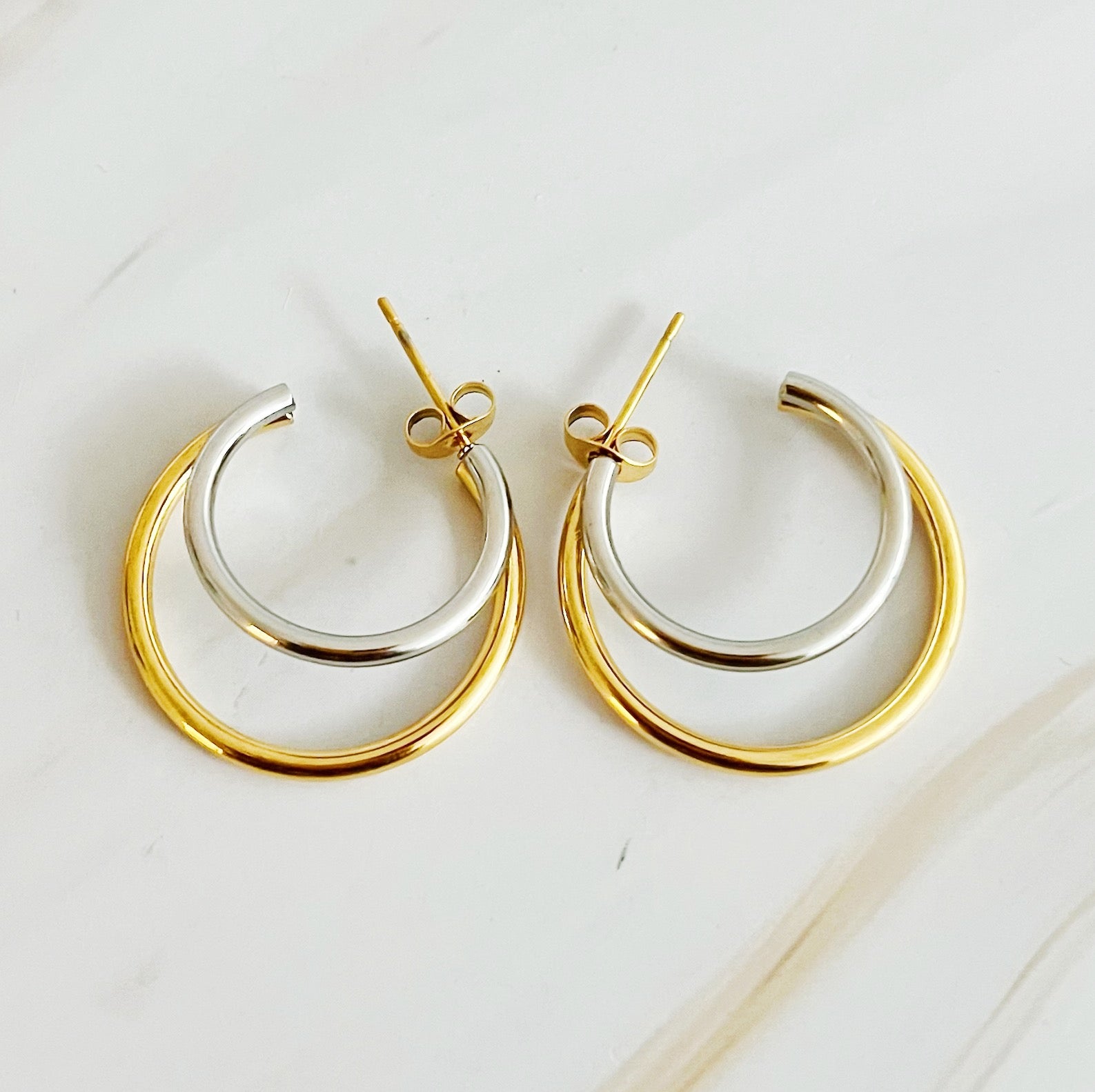 Elegant Uptown Two Tone Hoop Earrings featuring a modern design with 18k gold plating, perfect for any occasion.