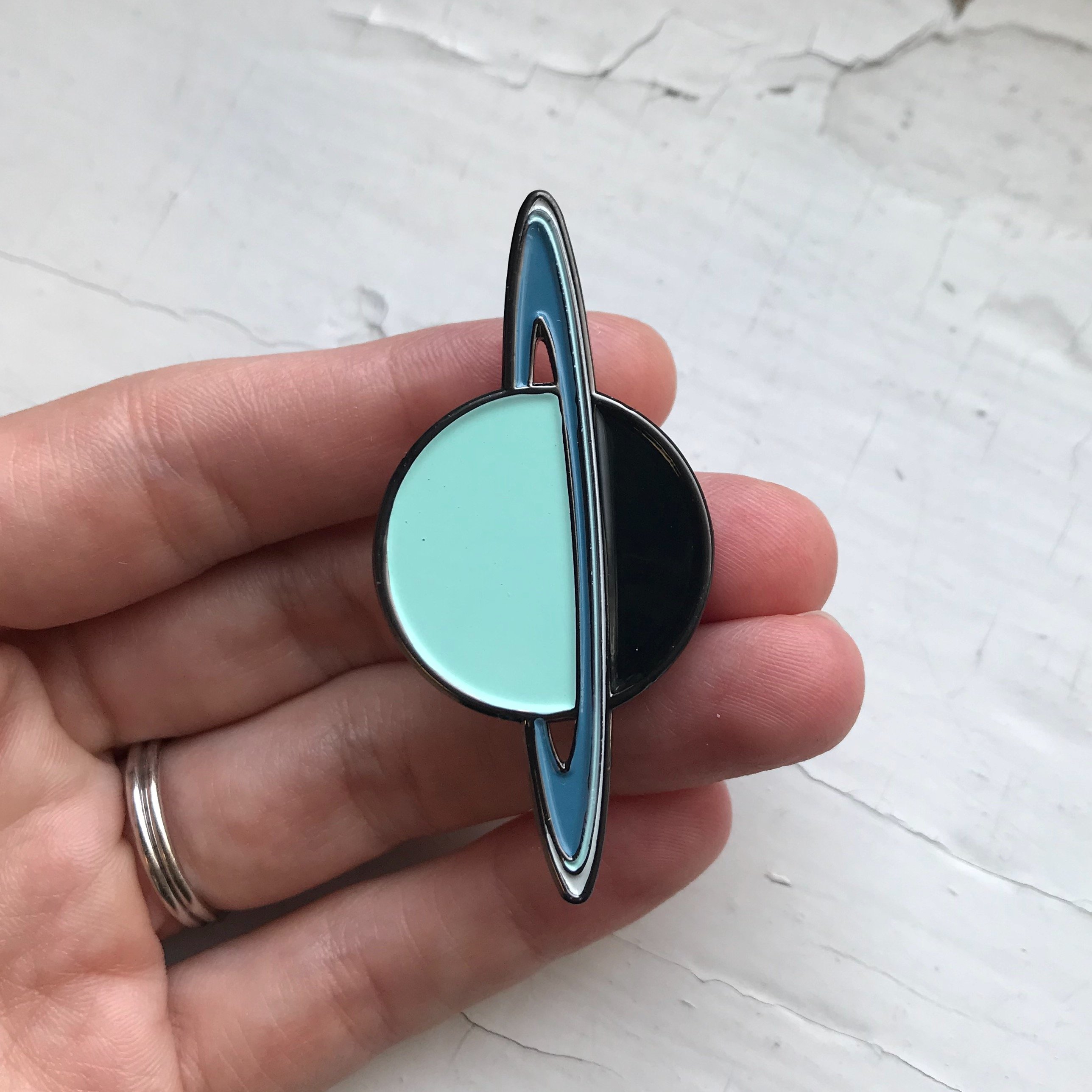 Uranus Enamel Pin featuring a whimsical design by Lauren Beacham, perfect for jackets and backpacks.