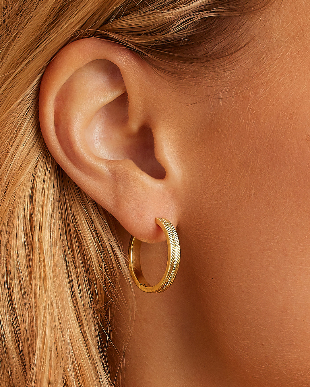 Elegant Venice Hoops crafted with high-quality materials, showcasing a sleek design perfect for any outfit.