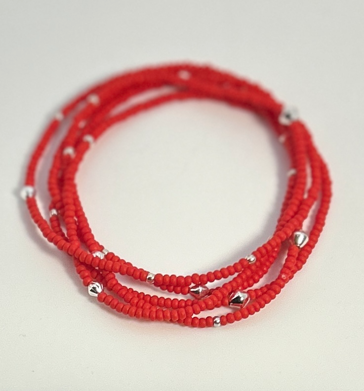 Vibrant bright red beaded boho wrap bracelet with silver and gold accents, showcasing a stylish design perfect for stacking or solo wear.