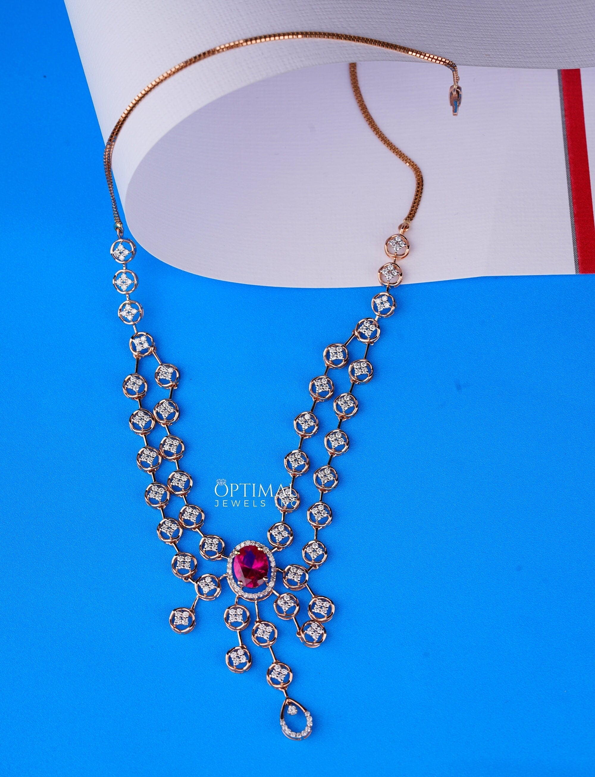 Vibrant Pink Ruby Gemstone Necklace featuring 3.50 CTW oval cut sparkling diamonds in a rose gold setting, elegantly displayed.