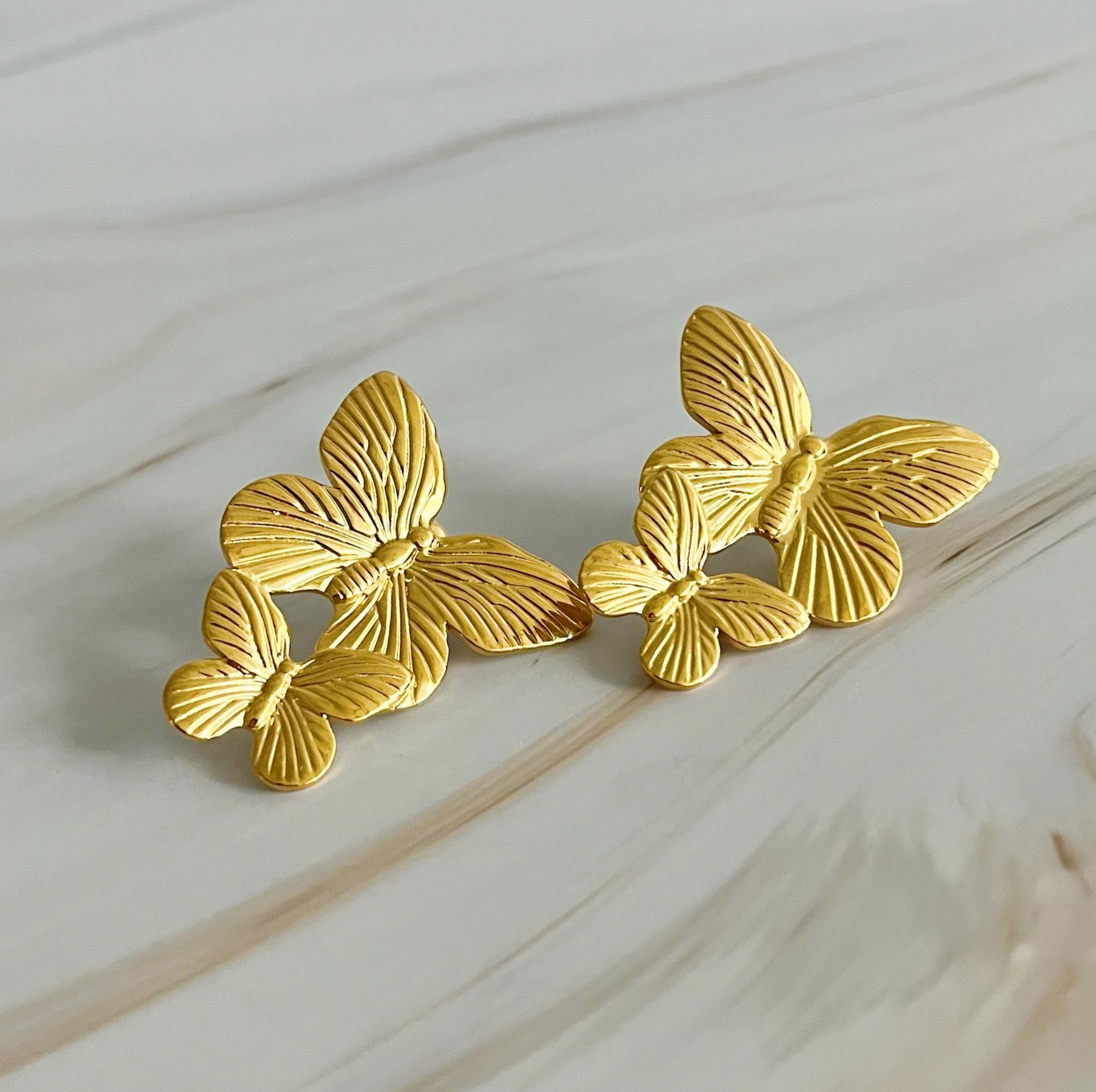 Elegant Vintage Butterfly Duo Earrings in gold plating, showcasing a unique butterfly design.