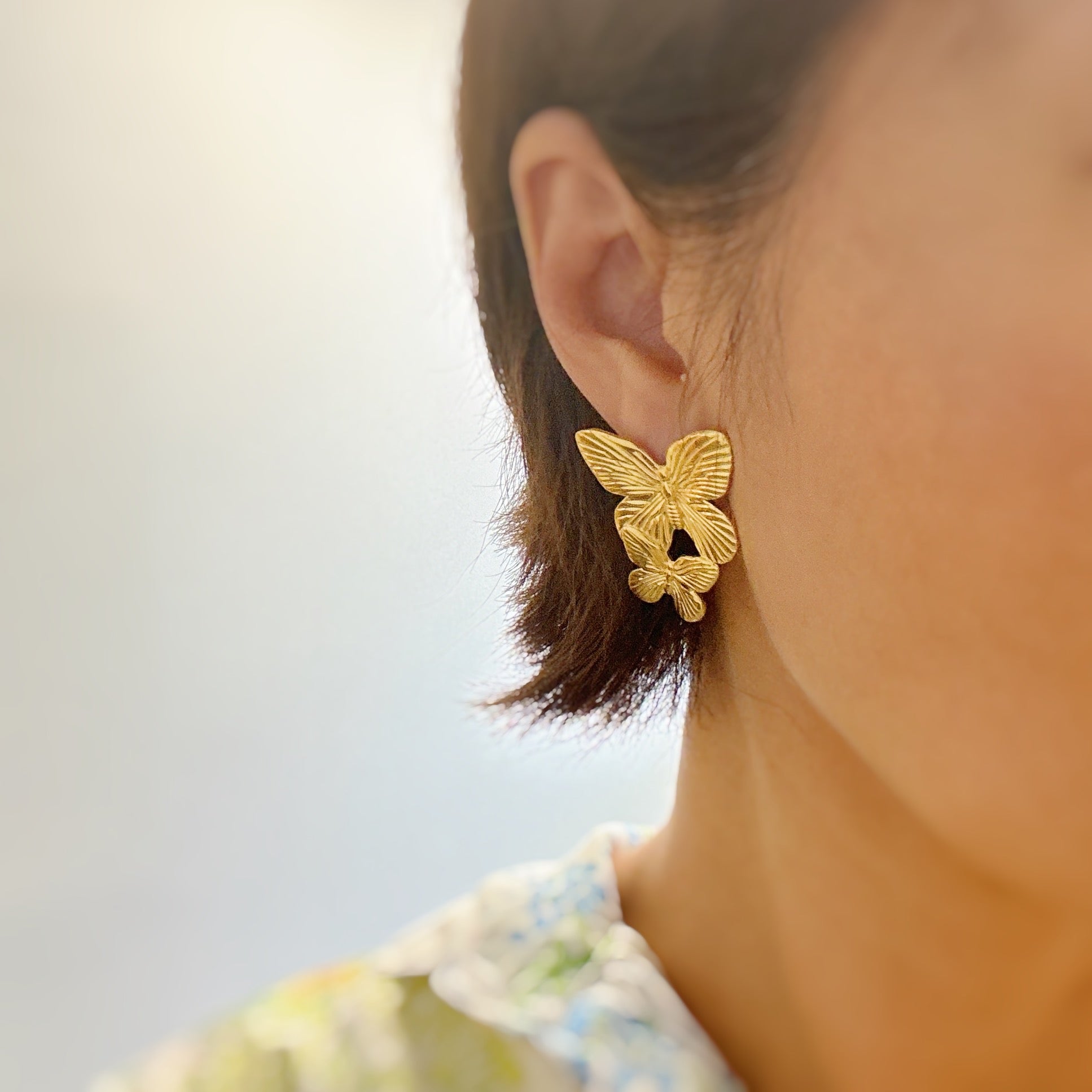 Elegant Vintage Butterfly Duo Earrings in gold plating, showcasing a unique butterfly design.