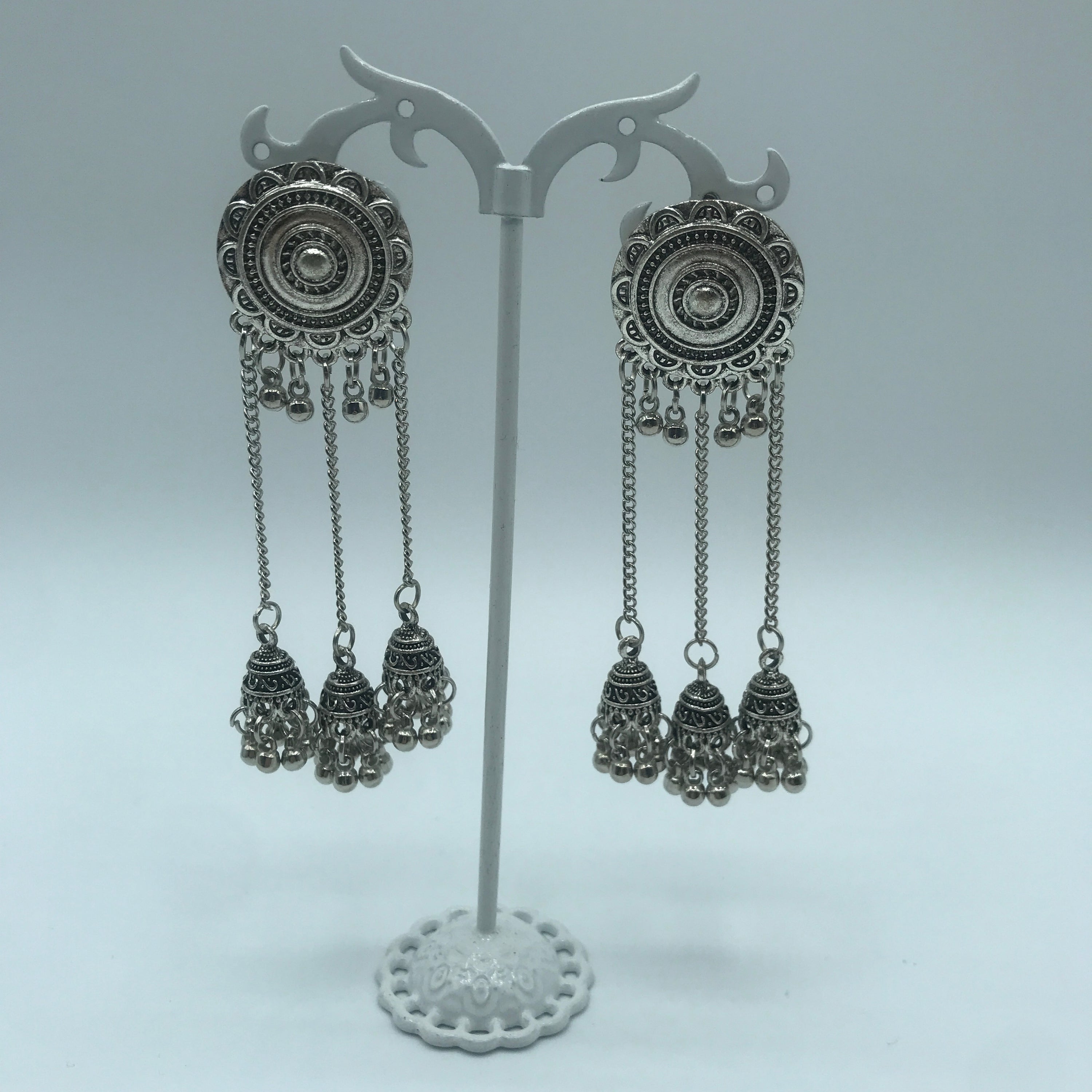 Vintage sunflower triple bell tassel earrings featuring intricate sunflower design and playful tassels, crafted from lightweight alloy.