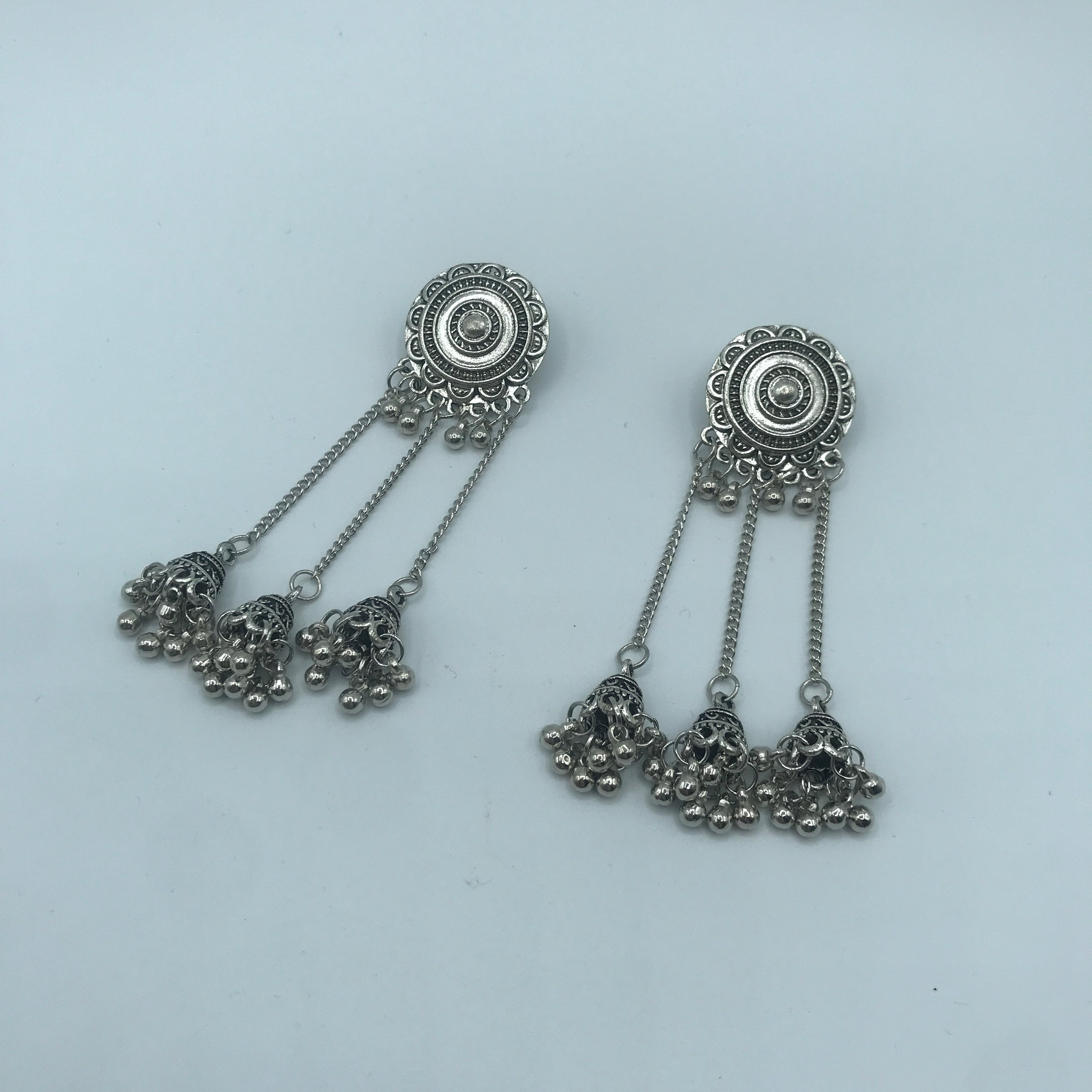 Vintage sunflower triple bell tassel earrings featuring intricate sunflower design and playful tassels, crafted from lightweight alloy.