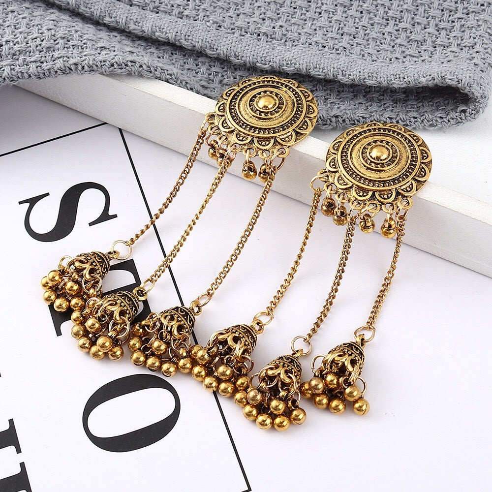 Vintage sunflower triple bell tassel earrings featuring intricate sunflower design and playful tassels, crafted from lightweight alloy.