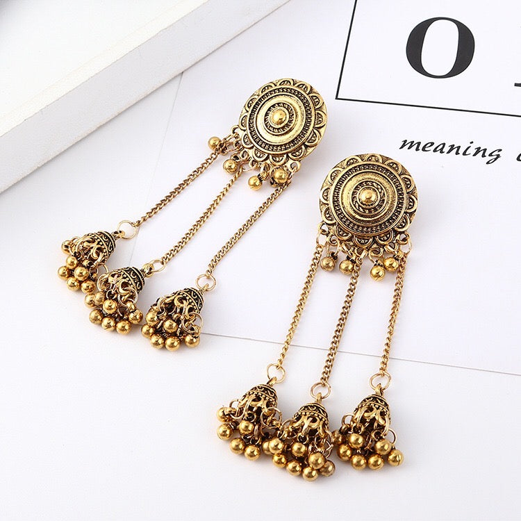 Vintage sunflower triple bell tassel earrings featuring intricate sunflower design and playful tassels, crafted from lightweight alloy.