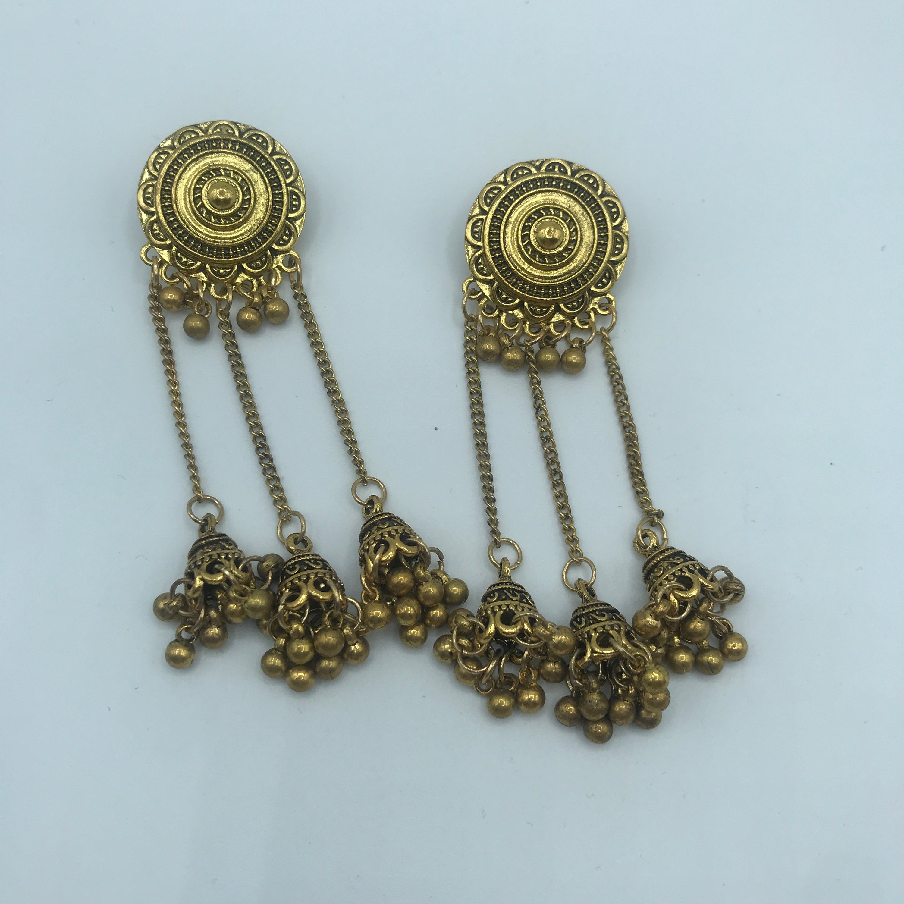 Vintage sunflower triple bell tassel earrings featuring intricate sunflower design and playful tassels, crafted from lightweight alloy.
