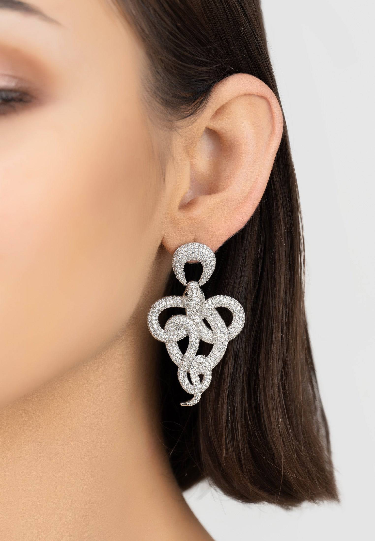 Viper Snake Drop Earrings in silver and white with cubic zirconia accents, showcasing a curled snake design.