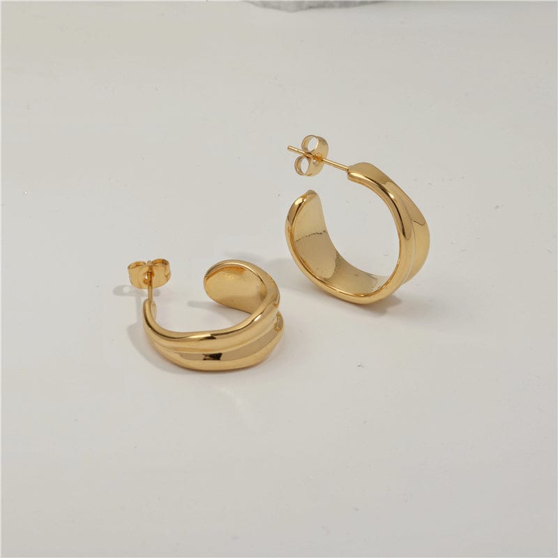 Vitenka Textured Uneven Hoop Earrings showcasing a contemporary design in stainless steel with 18Kt yellow gold coating.