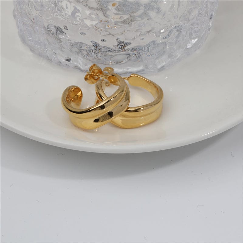 Vitenka Textured Uneven Hoop Earrings showcasing a contemporary design in stainless steel with 18Kt yellow gold coating.
