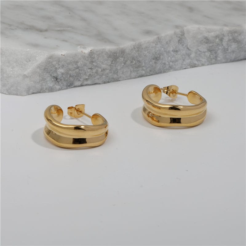 Vitenka Textured Uneven Hoop Earrings showcasing a contemporary design in stainless steel with 18Kt yellow gold coating.