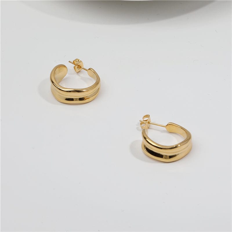 Vitenka Textured Uneven Hoop Earrings showcasing a contemporary design in stainless steel with 18Kt yellow gold coating.