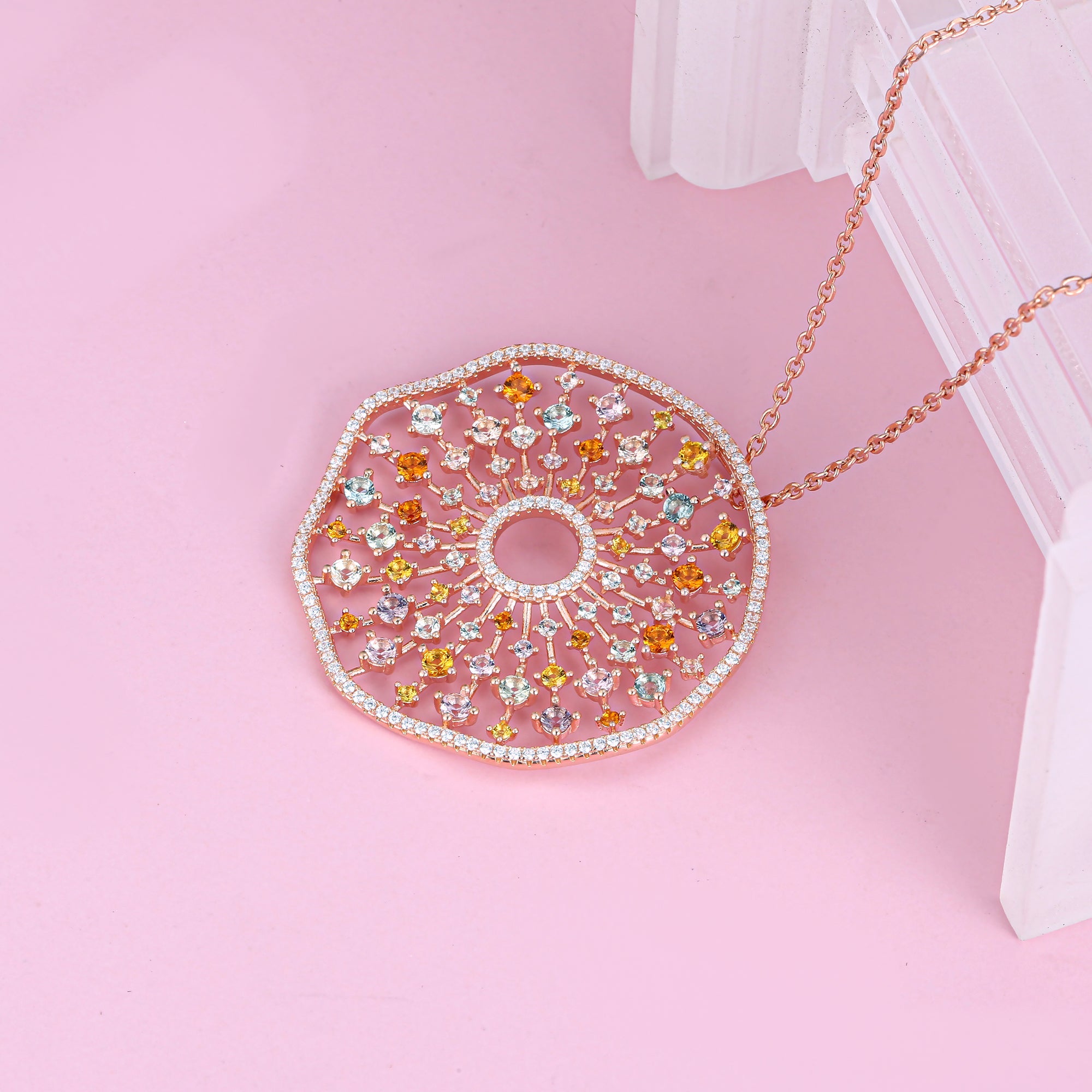 A stunning rose gold plarty necklace featuring colorful gemstones including white sapphire, amethyst, peridot, garnet, citrine, and tourmaline, perfect for special occasions.