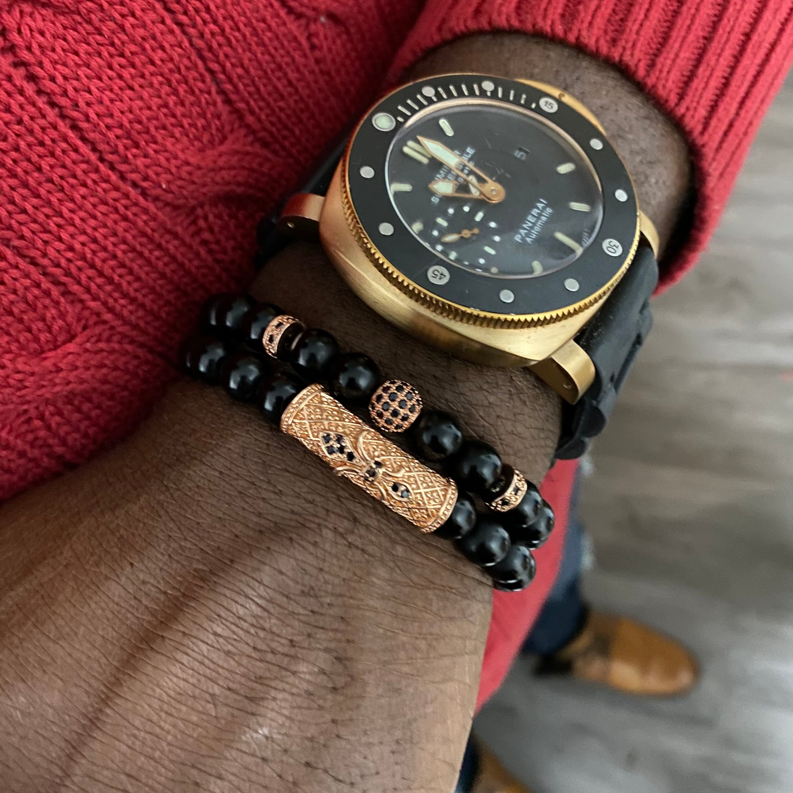 Vortex Bracelet Set featuring two black onyx bracelets with zirconia encrusted spacers in various metal colors.