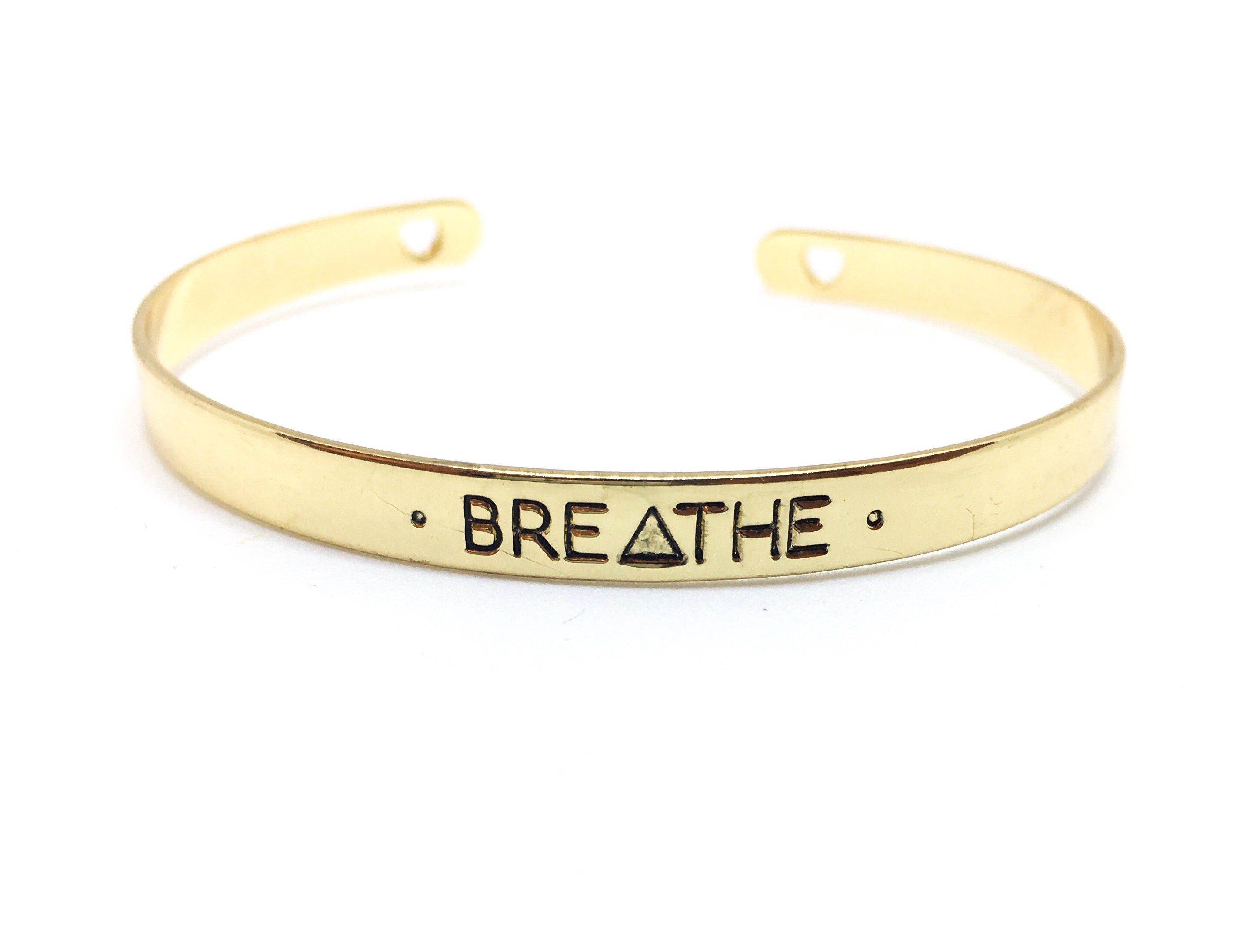 Wear Your Words Mantra Bangle in gold, silver, and rose gold finishes, showcasing its elegant design and adjustable size.