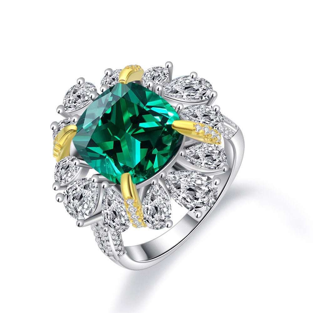A luxurious sterling silver ring featuring a 9 carat cushion canary created emerald and pear white sapphires, elegantly designed for gifting or personal wear.
