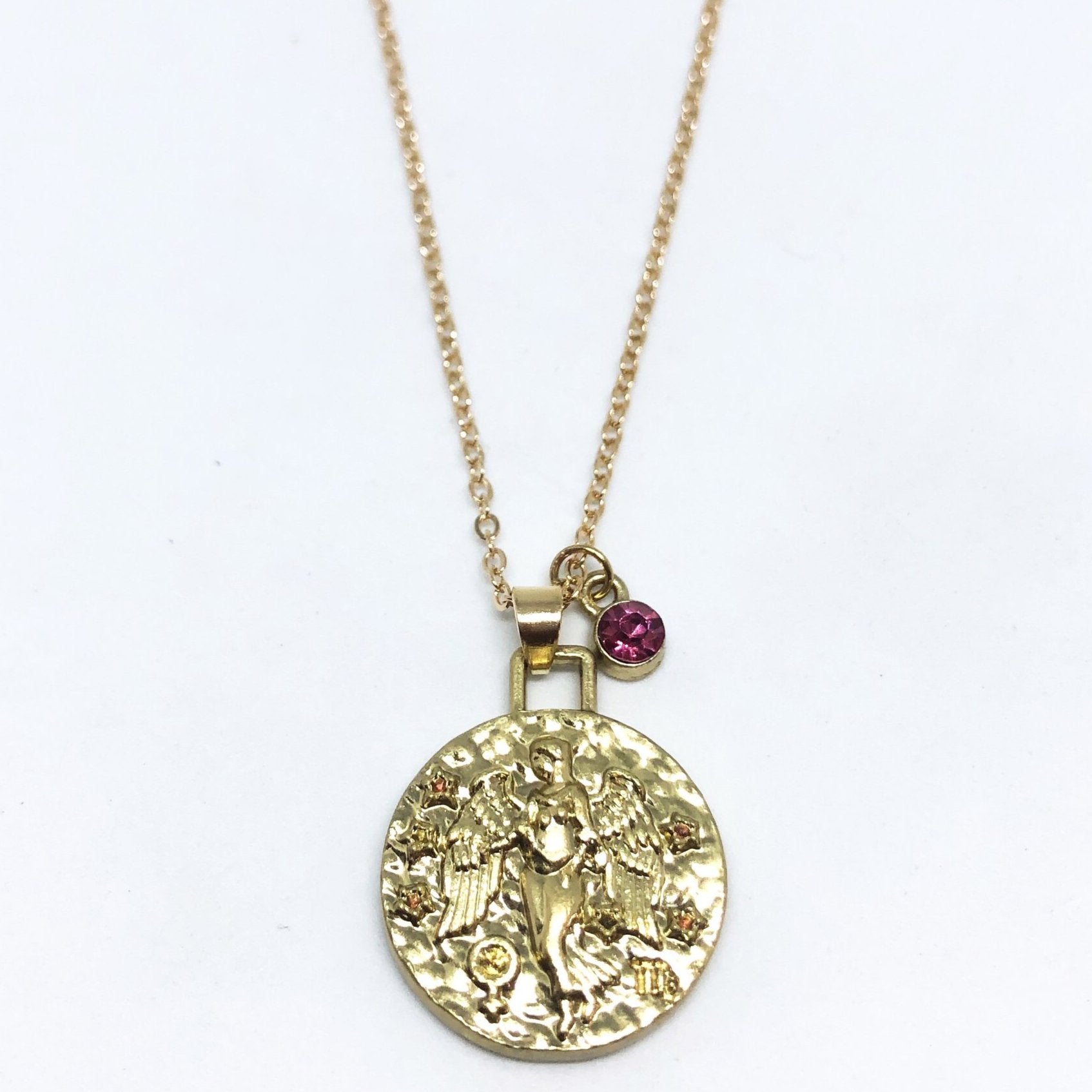 A beautiful 24K gold plated zodiac necklace featuring a double-sided pendant with astrological sign on one side and zodiac sign stamped on the other.