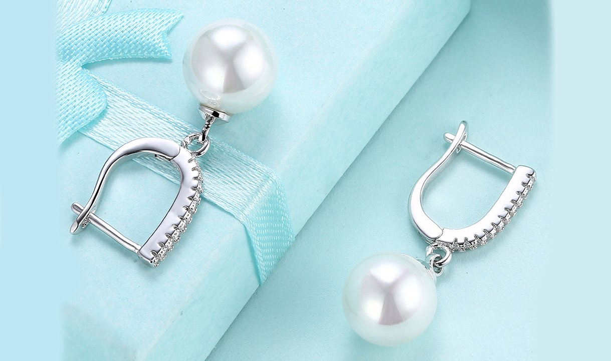 Elegant White Austrian Elements Thin Dangling Freshwater Pearl Clip On Earrings featuring 14K white gold plating and AAAAA quality stones.