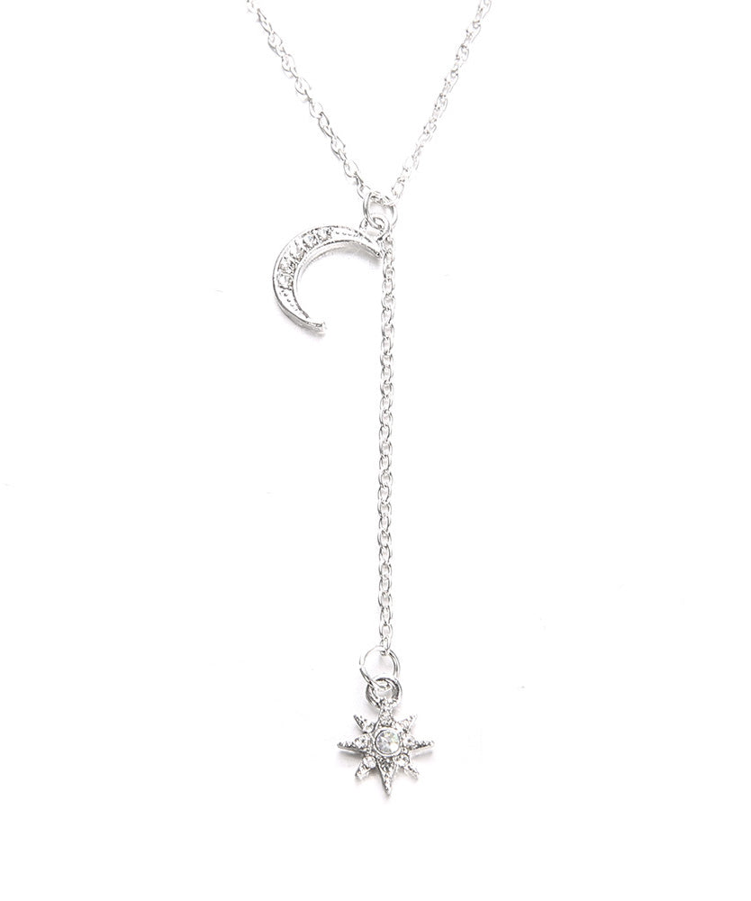 Elegant White Crystal Pav'e Star & Moon Lariat Necklace in 14K White Gold Plat featuring a star and moon pendant with sparkling AAAAA crystals.