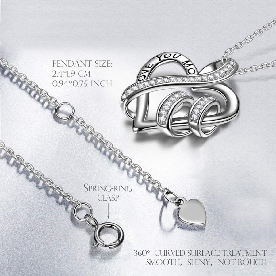 Elegant White Elements Pav'e Intertwined Heart Shaped Necklace in 14K white gold plating with a sparkling heart pendant.