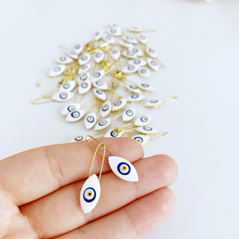 White Evil Eye Safety Pin featuring a brass design with an 8mm evil eye charm, perfect for weddings and baby showers.