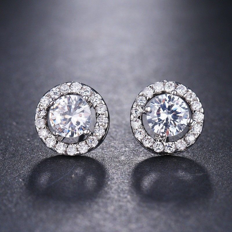 Elegant White Halo Stud Earrings in Silver Plating featuring Swarovski Elements, available in circle and square designs.