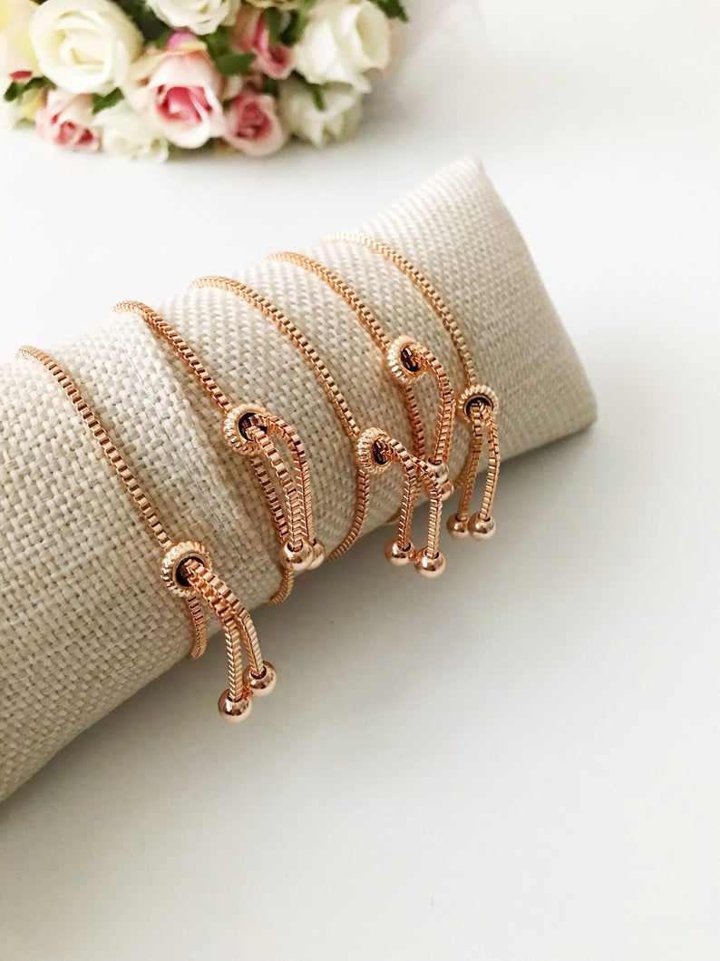 A beautiful White Murano Evil Eye Bracelet featuring a handmade Murano glass charm on an adjustable rose gold chain, showcasing elegance and durability.