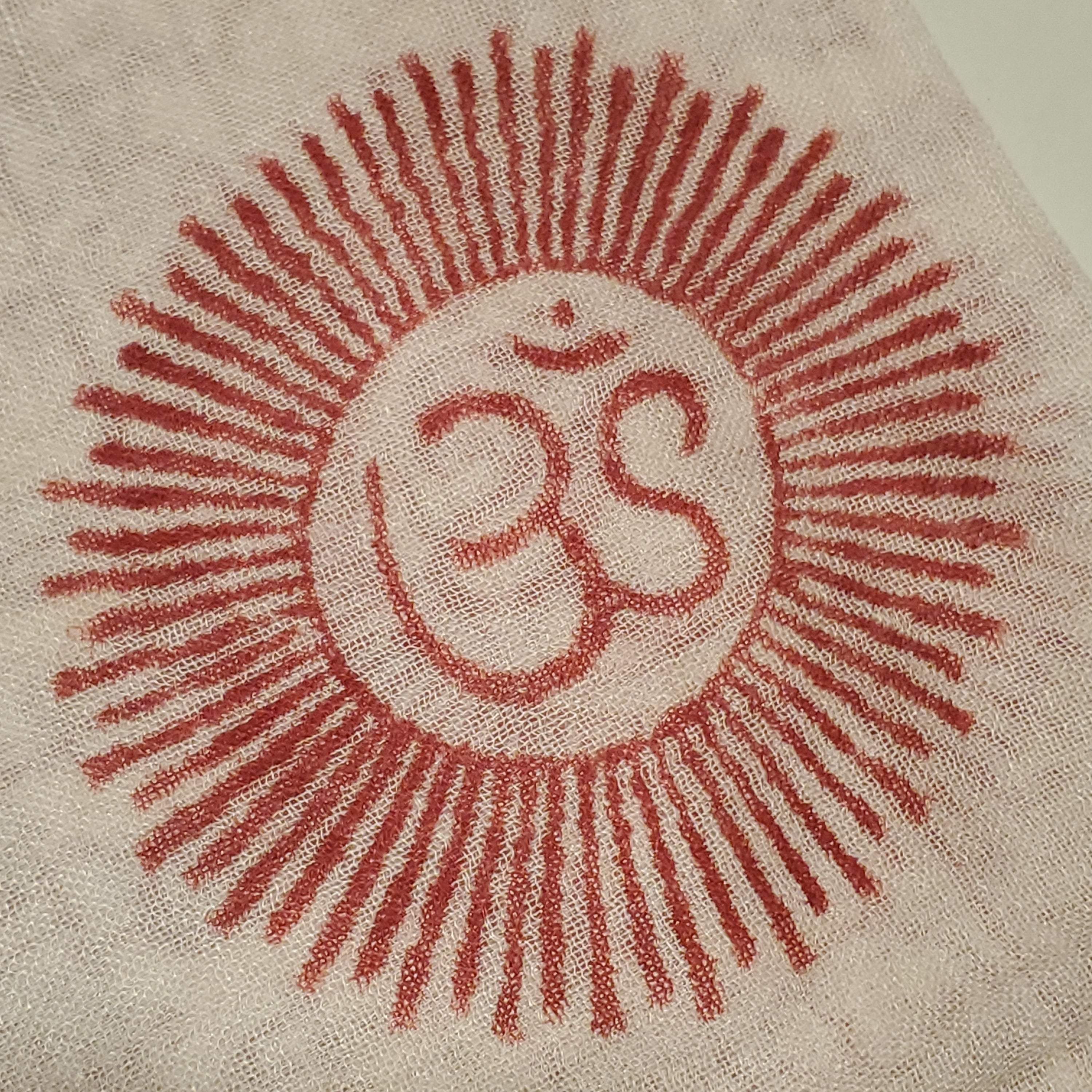 A luxurious white scarf featuring intricate Om symbols and Sanskrit writing, designed for meditation and traditional headwear.