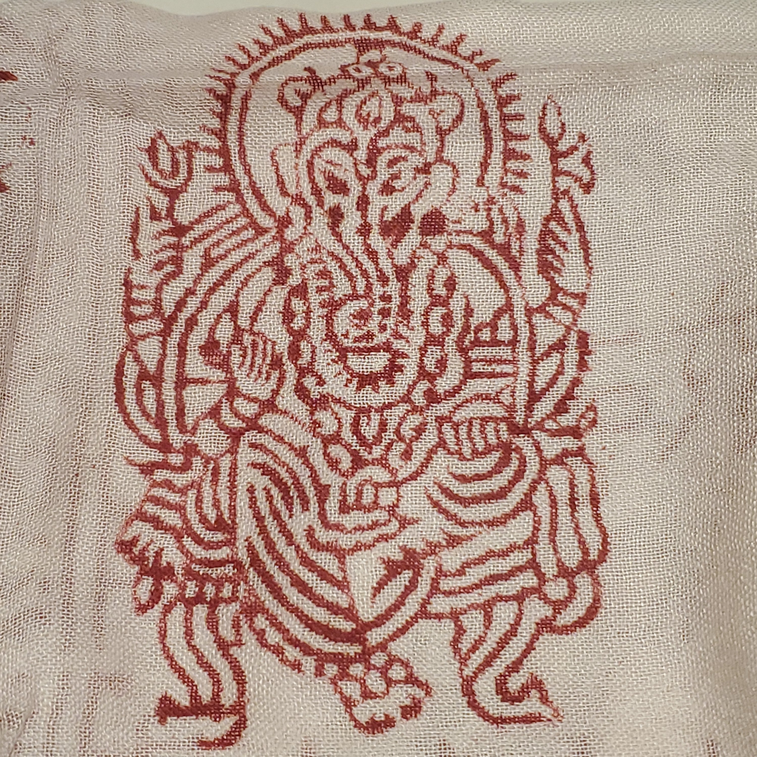 A luxurious white scarf featuring intricate Om symbols and Sanskrit writing, designed for meditation and traditional headwear.