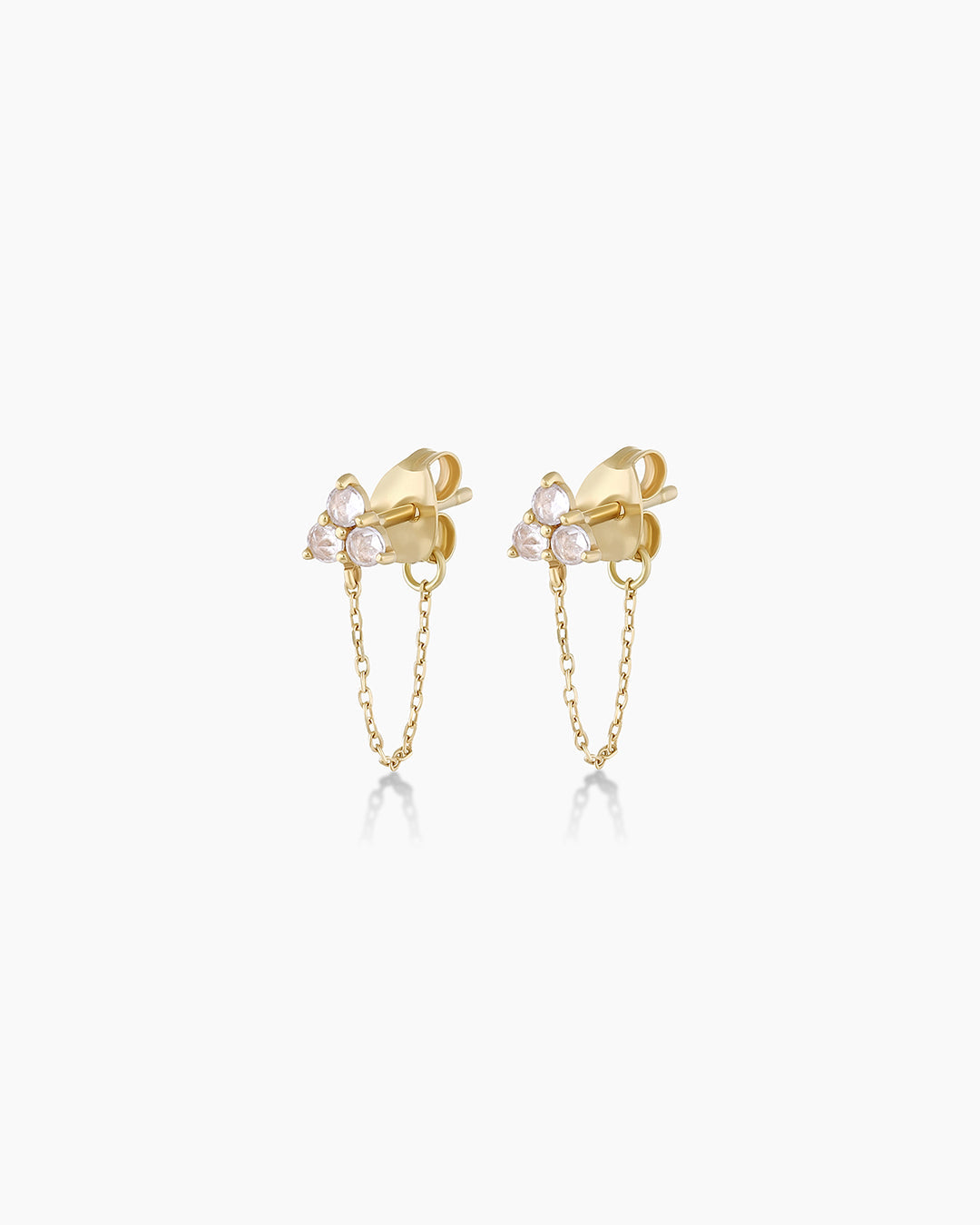 A pair of elegant 14k solid gold chain huggies featuring three sparkling white sapphires on each earring.